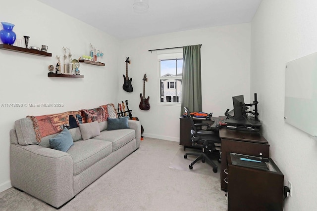 office featuring light colored carpet and baseboards