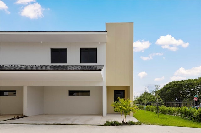 view of building exterior featuring fence