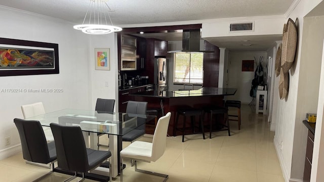 dining space featuring light tile patterned floors, baseboards, visible vents, ornamental molding, and a textured ceiling