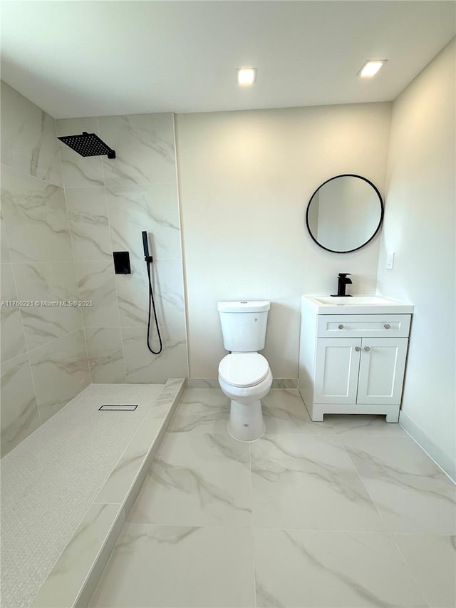 full bathroom with marble finish floor, toilet, vanity, and a shower stall