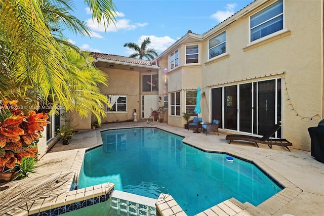 view of pool featuring a pool with connected hot tub