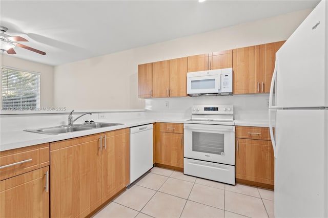 kitchen with light tile patterned floors, light countertops, ceiling fan, a sink, and white appliances