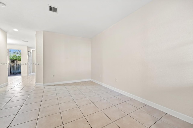 unfurnished room featuring recessed lighting, visible vents, baseboards, and light tile patterned floors