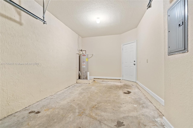 garage featuring electric panel, water heater, and a textured wall