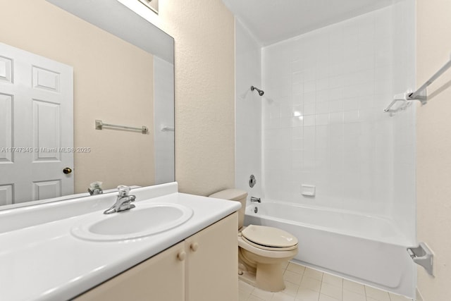 bathroom featuring a textured wall, toilet, washtub / shower combination, vanity, and tile patterned floors