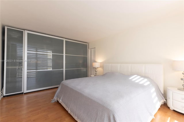 bedroom featuring wood finished floors