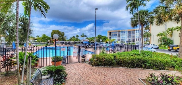 community pool featuring fence