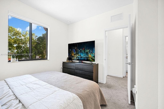 bedroom featuring carpet flooring, visible vents, and baseboards