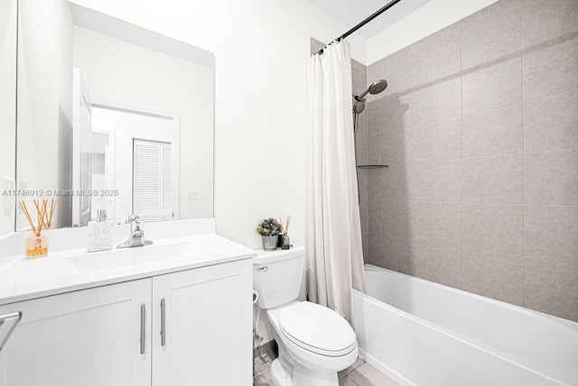 bathroom with shower / tub combo, vanity, and toilet