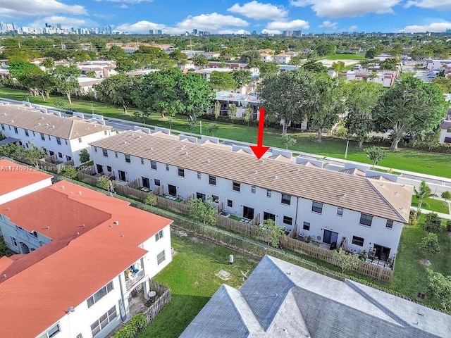 birds eye view of property with a residential view