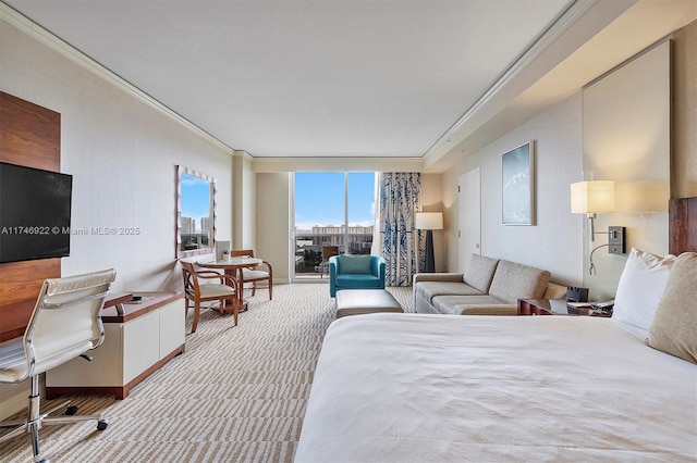 bedroom featuring a city view, ornamental molding, a wall of windows, and light colored carpet