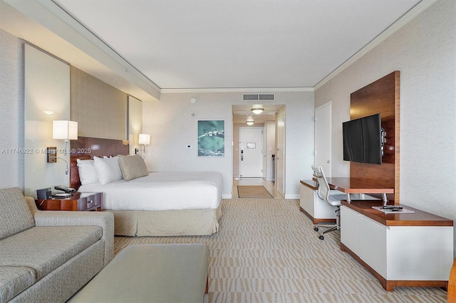 bedroom featuring crown molding, baseboards, visible vents, and light colored carpet