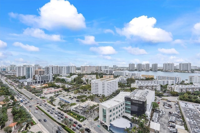 aerial view featuring a view of city and a water view