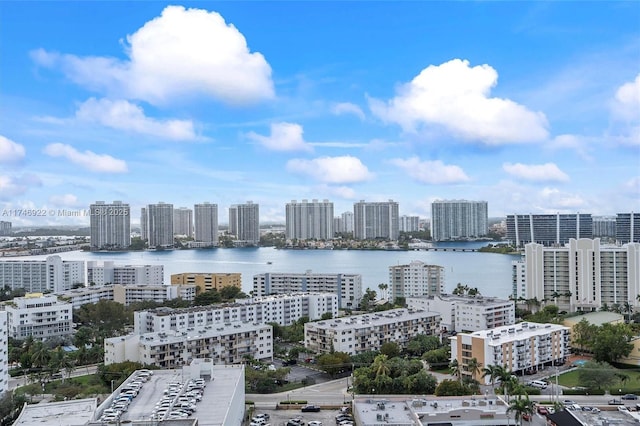 birds eye view of property with a view of city and a water view