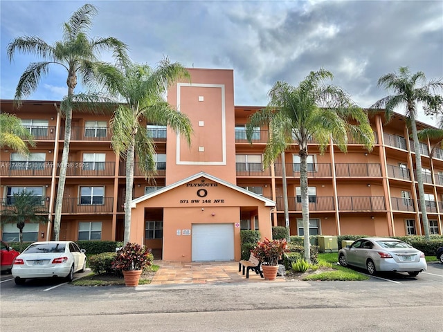 view of property with uncovered parking