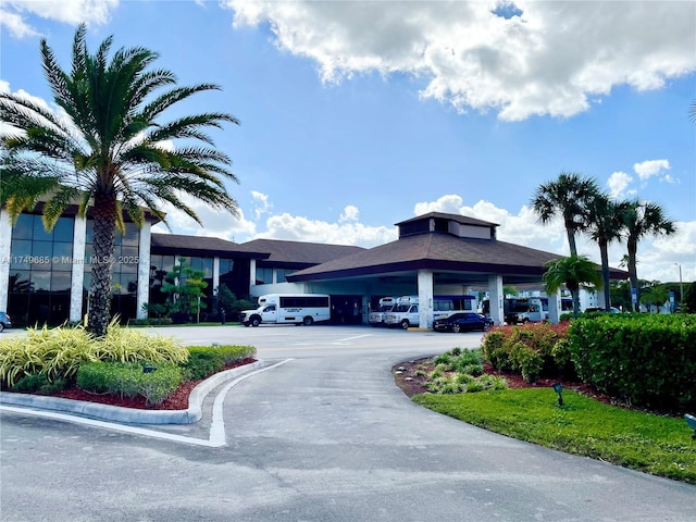 view of building exterior featuring uncovered parking