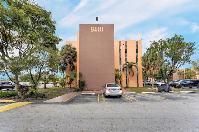 view of property with uncovered parking