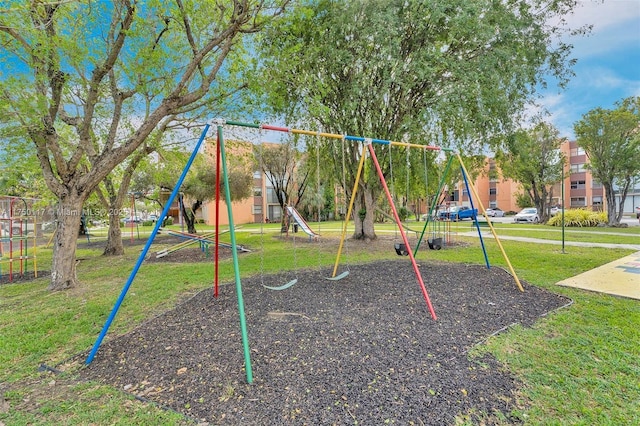 communal playground featuring a yard