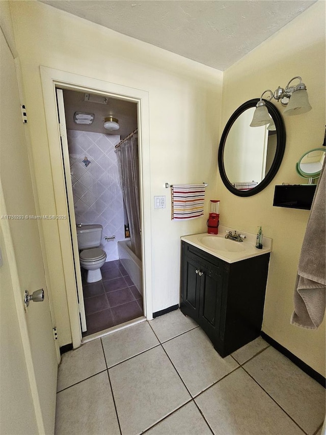 full bath with shower / bathtub combination with curtain, toilet, vanity, baseboards, and tile patterned floors