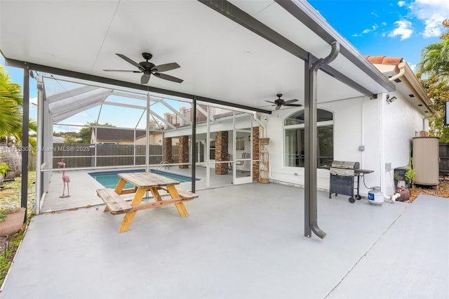 view of patio featuring a fenced in pool, glass enclosure, ceiling fan, and area for grilling