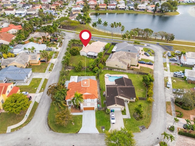 aerial view with a residential view and a water view