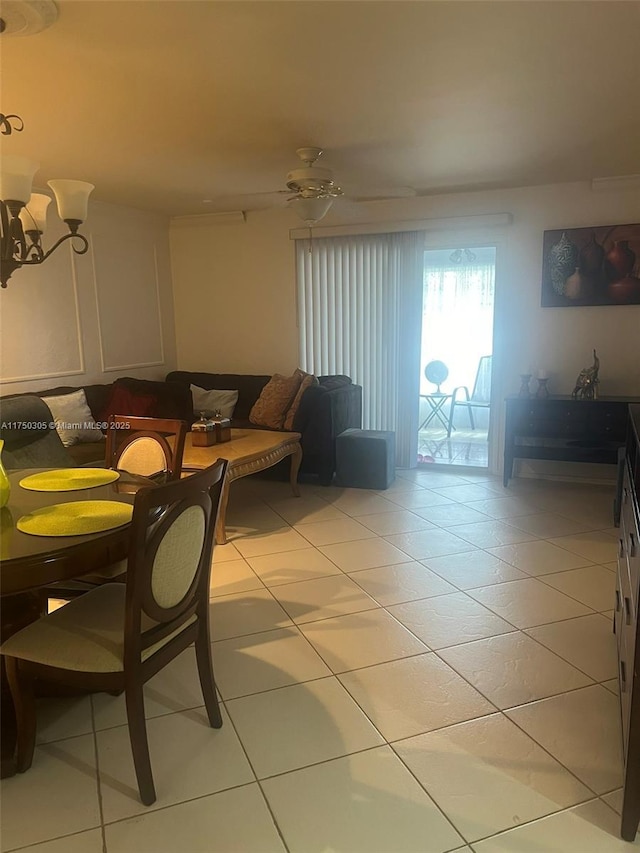 living area featuring ceiling fan and light tile patterned floors