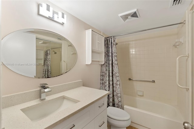 bathroom featuring visible vents, vanity, toilet, and shower / bath combo with shower curtain