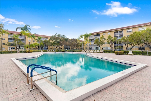 community pool featuring a patio area