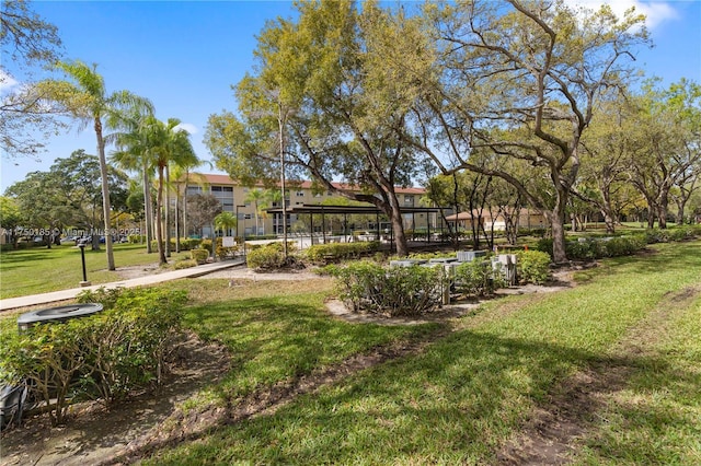 view of home's community with a yard