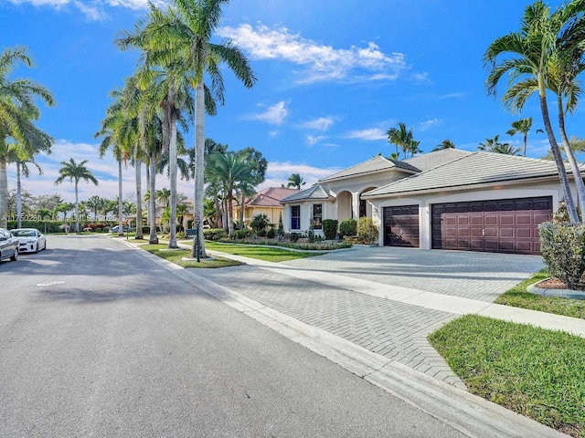 ranch-style house featuring curbs and sidewalks