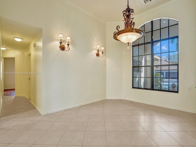 empty room featuring light tile patterned floors, ornamental molding, visible vents, and baseboards