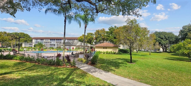 exterior space featuring a yard and a pool