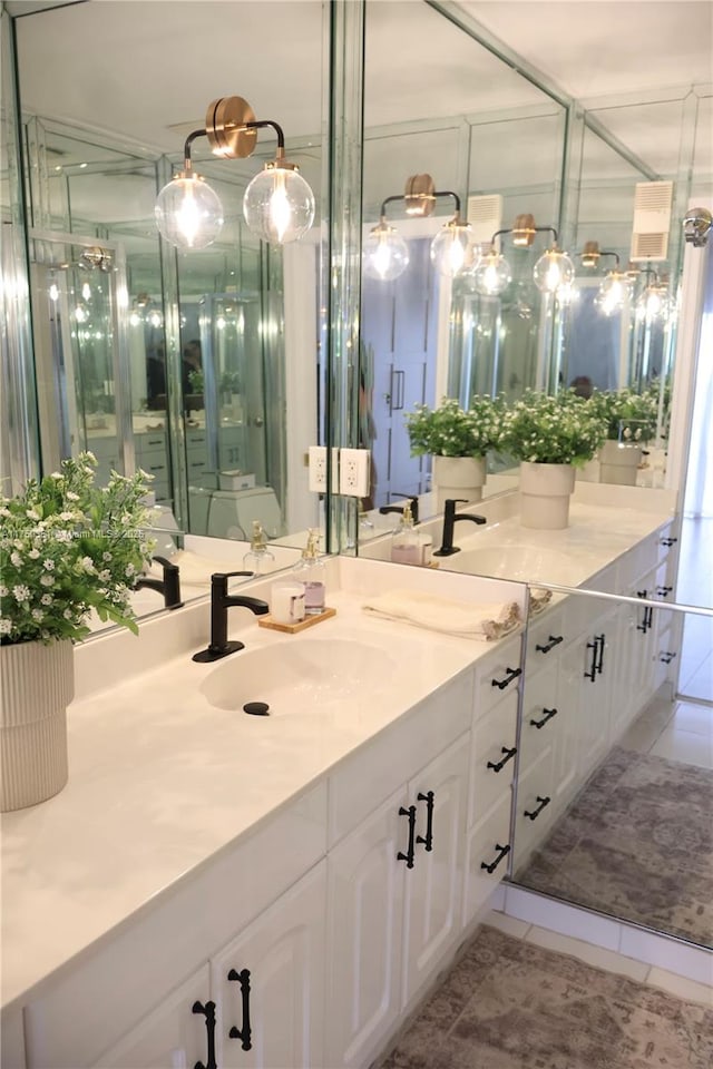 bathroom with vanity and tile patterned floors