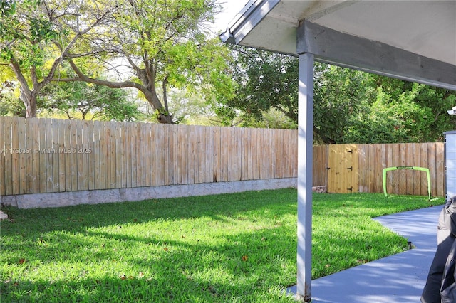 view of yard with a fenced backyard