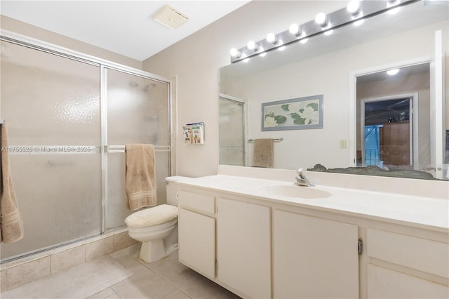 bathroom with a stall shower, tile patterned flooring, vanity, and toilet