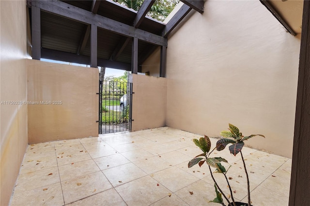 view of patio featuring a gate