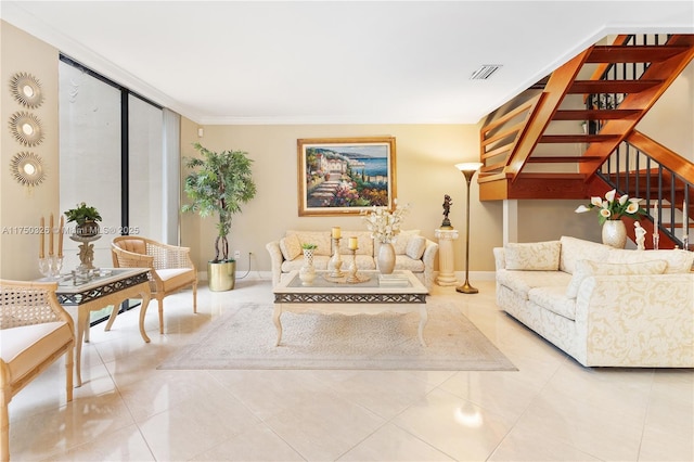 living room featuring light tile patterned floors, stairway, visible vents, and baseboards