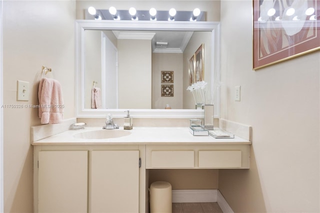 bathroom featuring ornamental molding and vanity