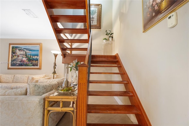 staircase featuring visible vents