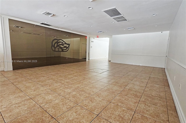 spare room with light tile patterned flooring, visible vents, and recessed lighting