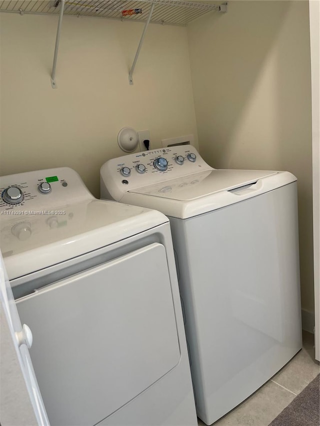 laundry room with laundry area and washer and clothes dryer