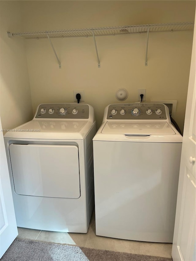 laundry room with laundry area and washer and clothes dryer