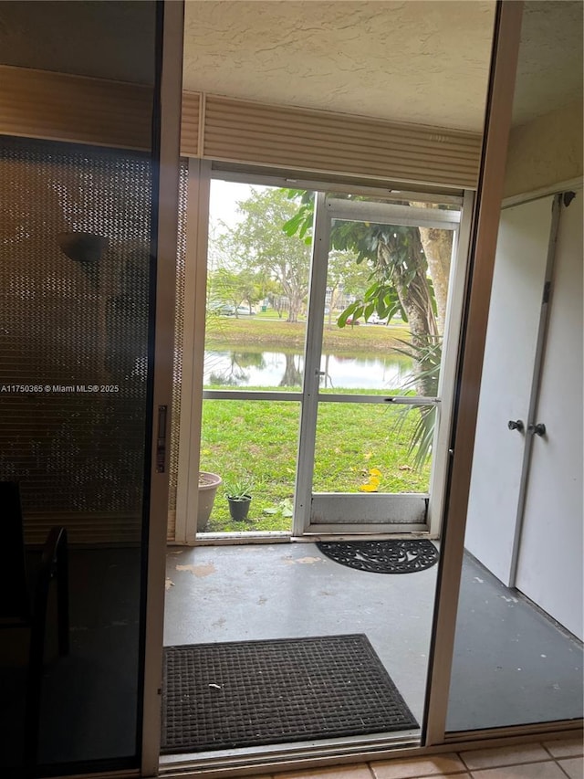 doorway featuring a water view