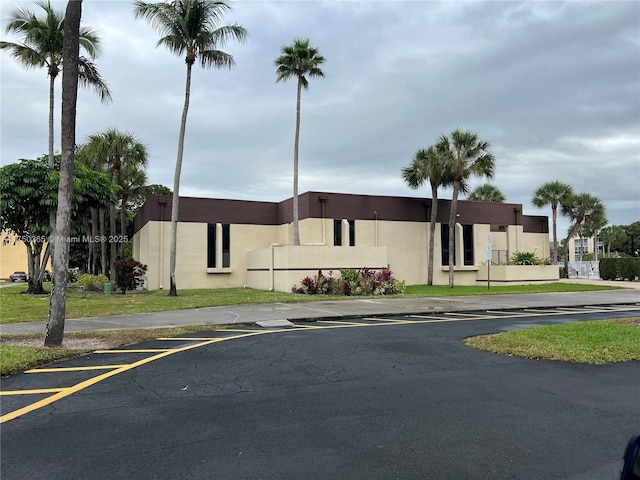 view of property featuring uncovered parking