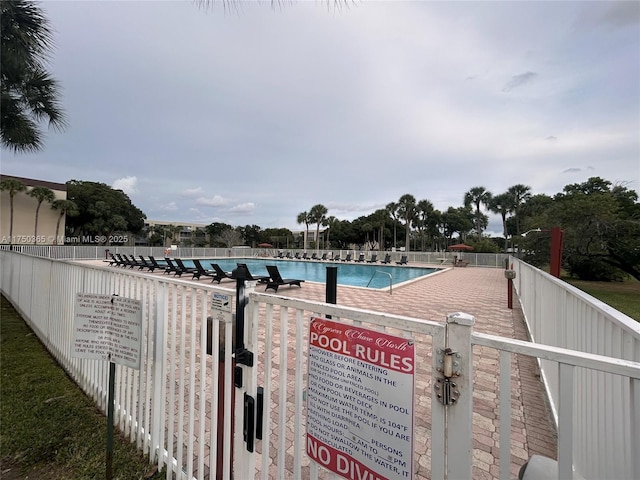 community pool featuring fence