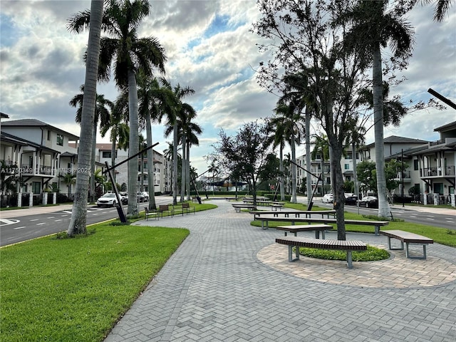 surrounding community featuring a yard and a residential view