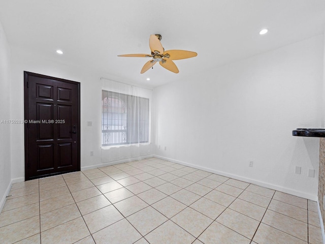 foyer entrance featuring baseboards and recessed lighting