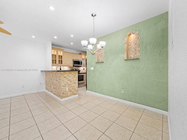 kitchen featuring appliances with stainless steel finishes, recessed lighting, baseboards, and light tile patterned floors