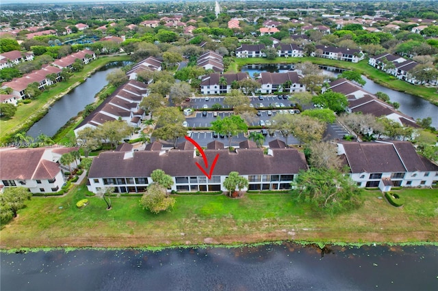 aerial view featuring a water view and a residential view