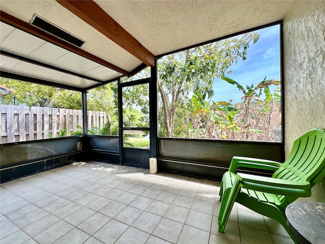 sunroom with beamed ceiling